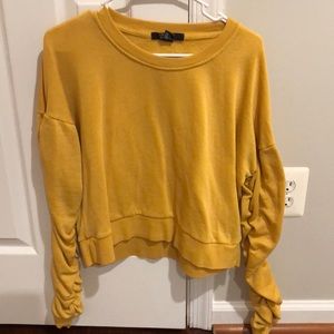 Sweater with ruffled sleeves